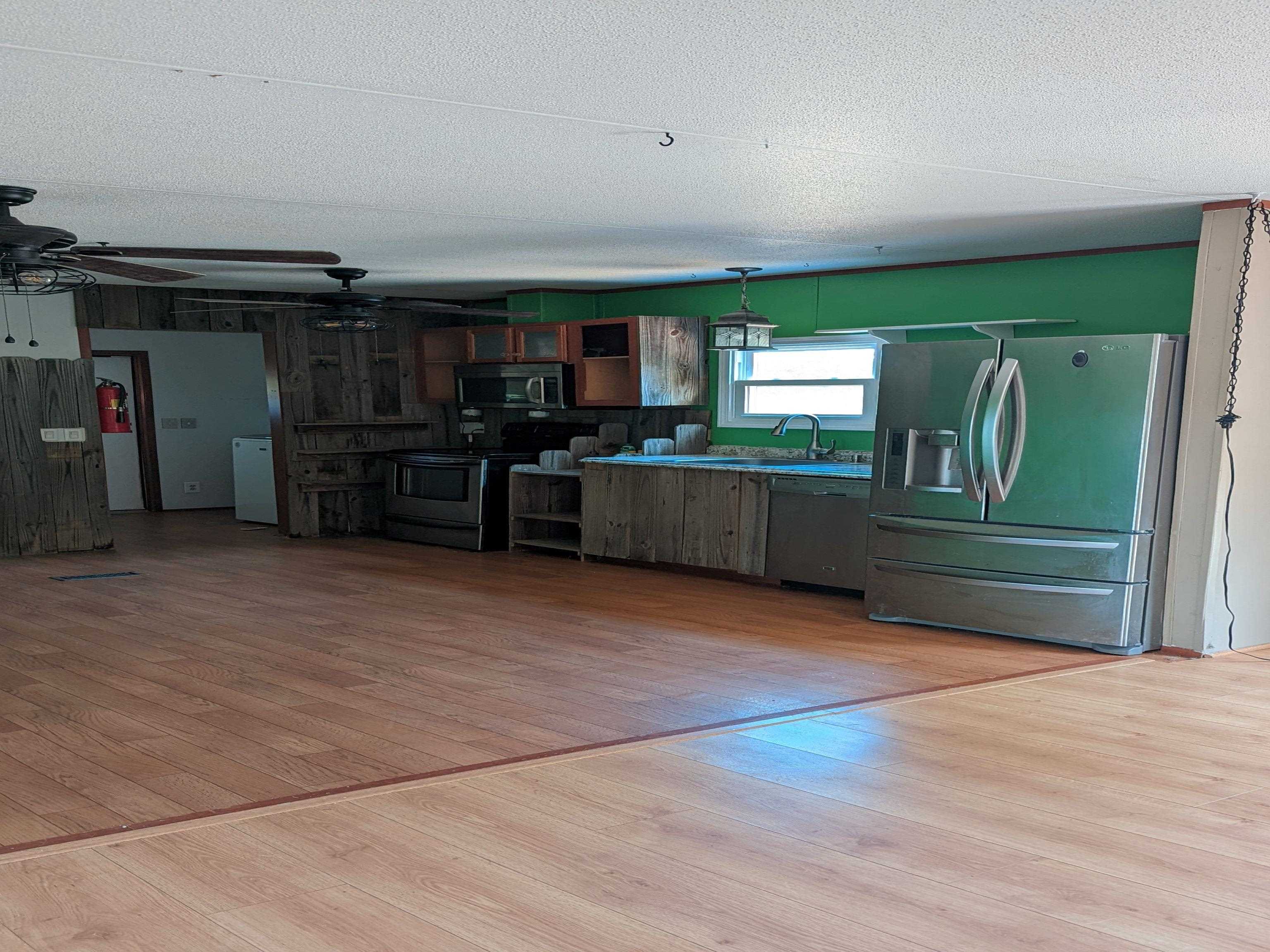 793 Robertson Road Mason, TN 38049 - Photo 6 of 23 a view of a livingroom with furniture and staircase
