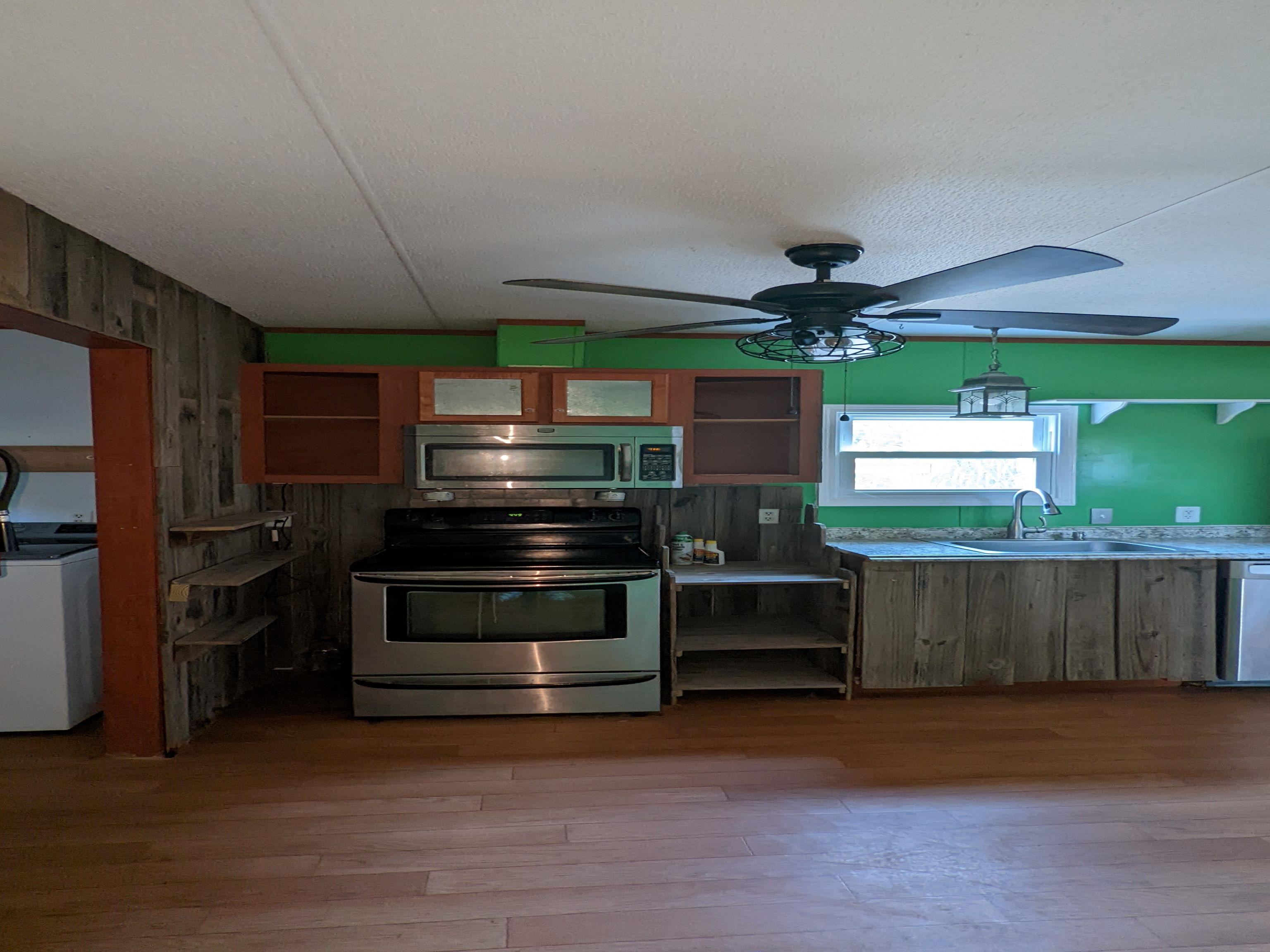 793 Robertson Road Mason, TN 38049 - Photo 7 of 23 a kitchen with stainless steel appliances a stove and a refrigerator
