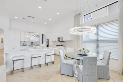 a kitchen with a table and chairs in it