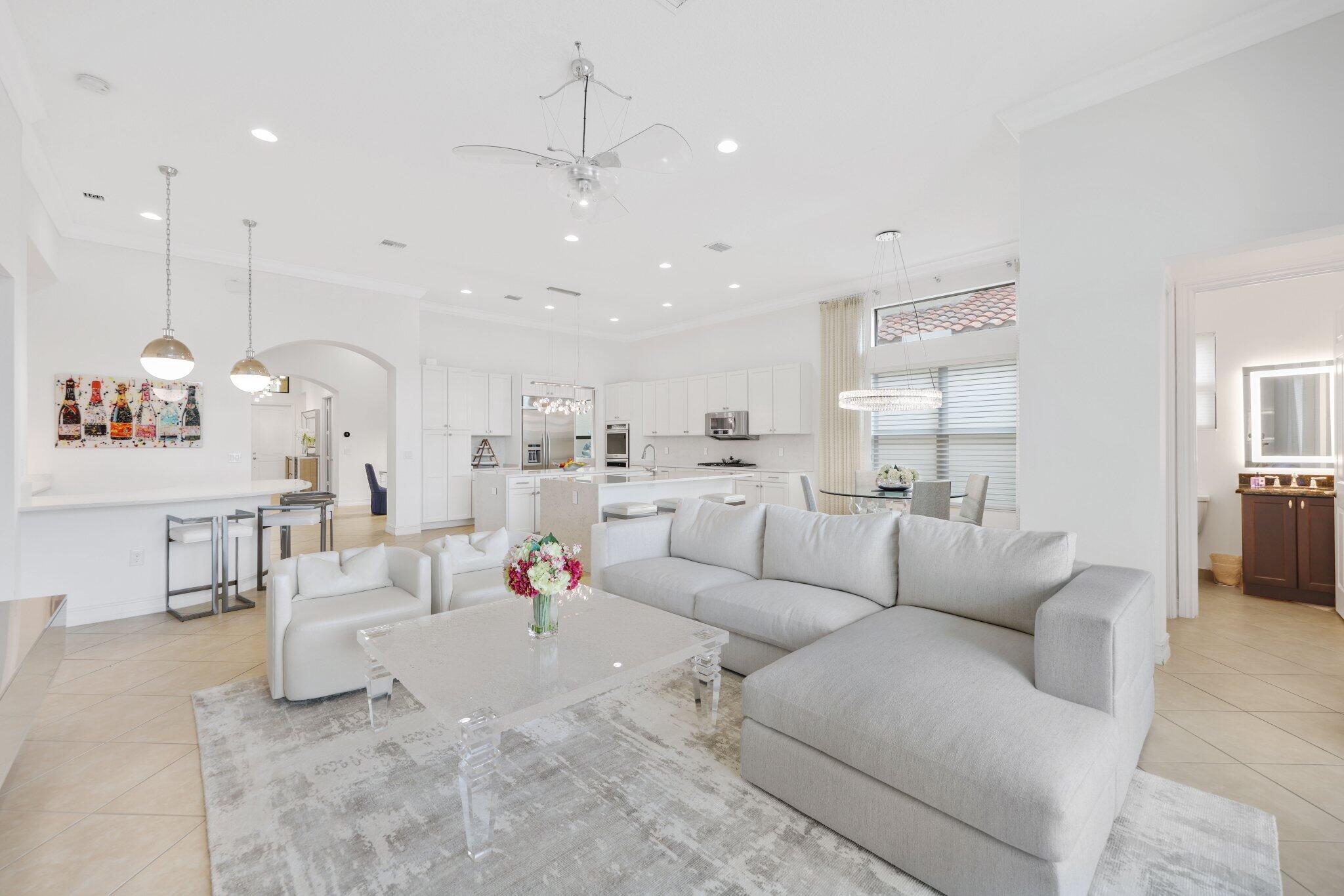8539 Lewis River Road Delray Beach, FL 33446 - Photo 21 of 49 a living room with furniture and kitchen view