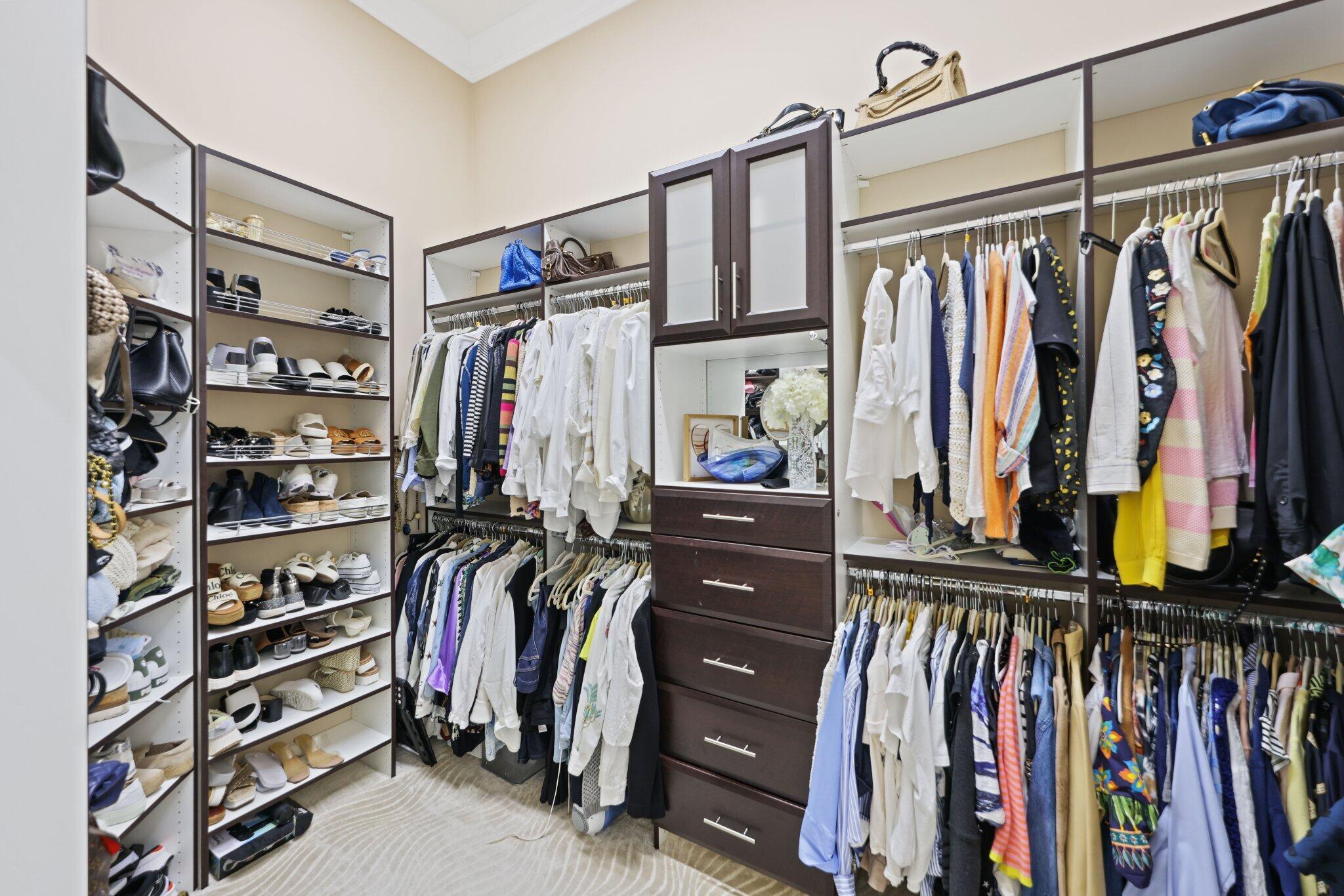 8539 Lewis River Road Delray Beach, FL 33446 - Photo 26 of 49 a view of walk in closet with clothes