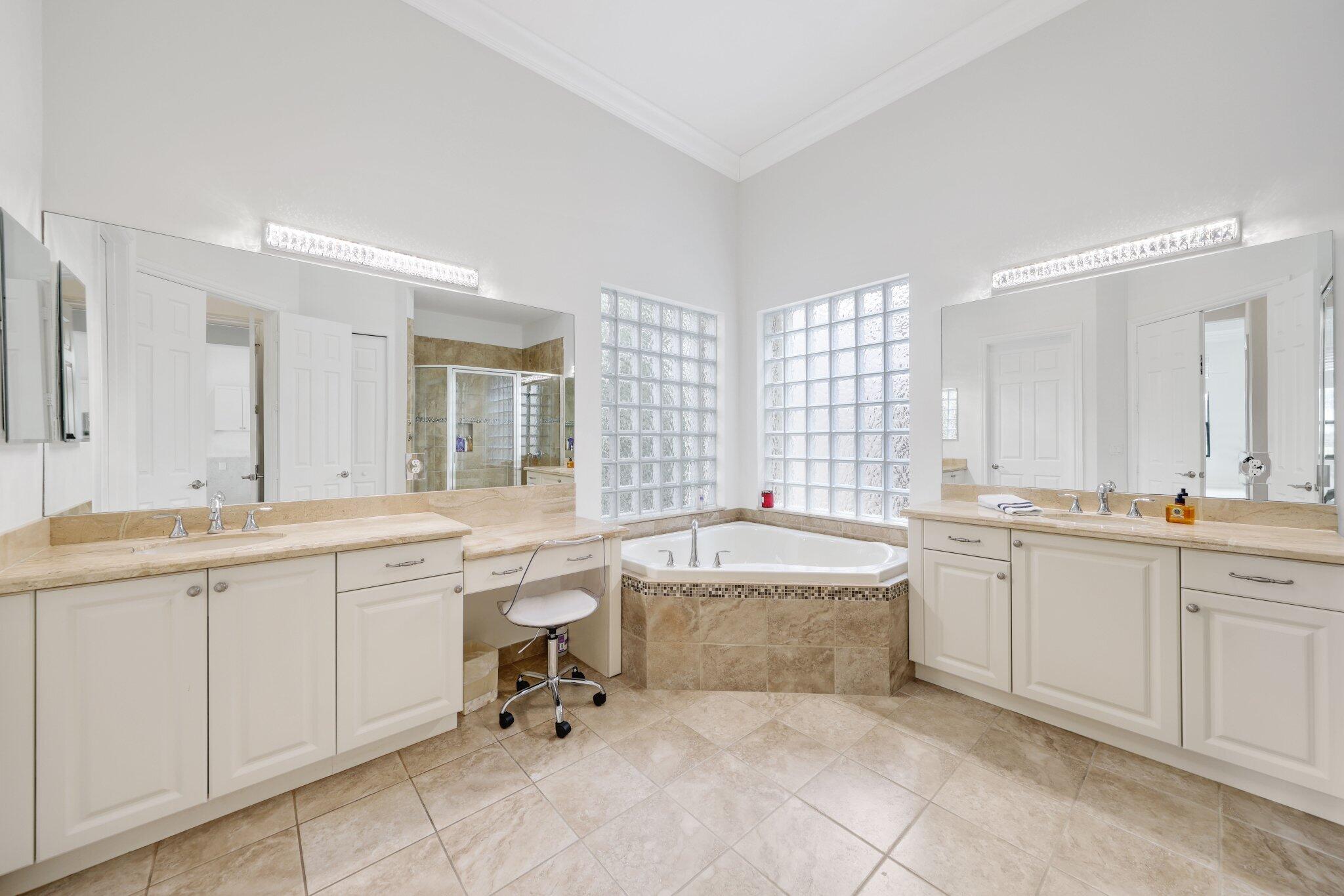 8539 Lewis River Road Delray Beach, FL 33446 - Photo 27 of 49 a large bathroom with a double vanity sink mirror and bathtub
