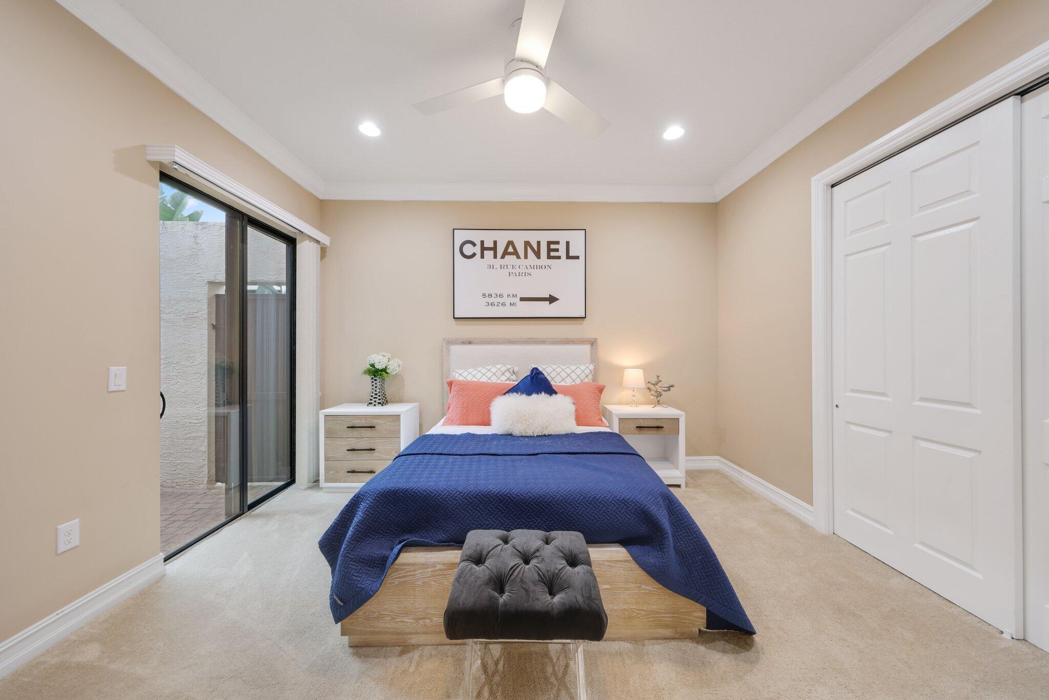 8539 Lewis River Road Delray Beach, FL 33446 - Photo 29 of 49 a bed room with a bed and a large mirror