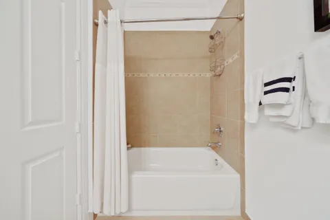 a bathroom with a bathtub and a shower