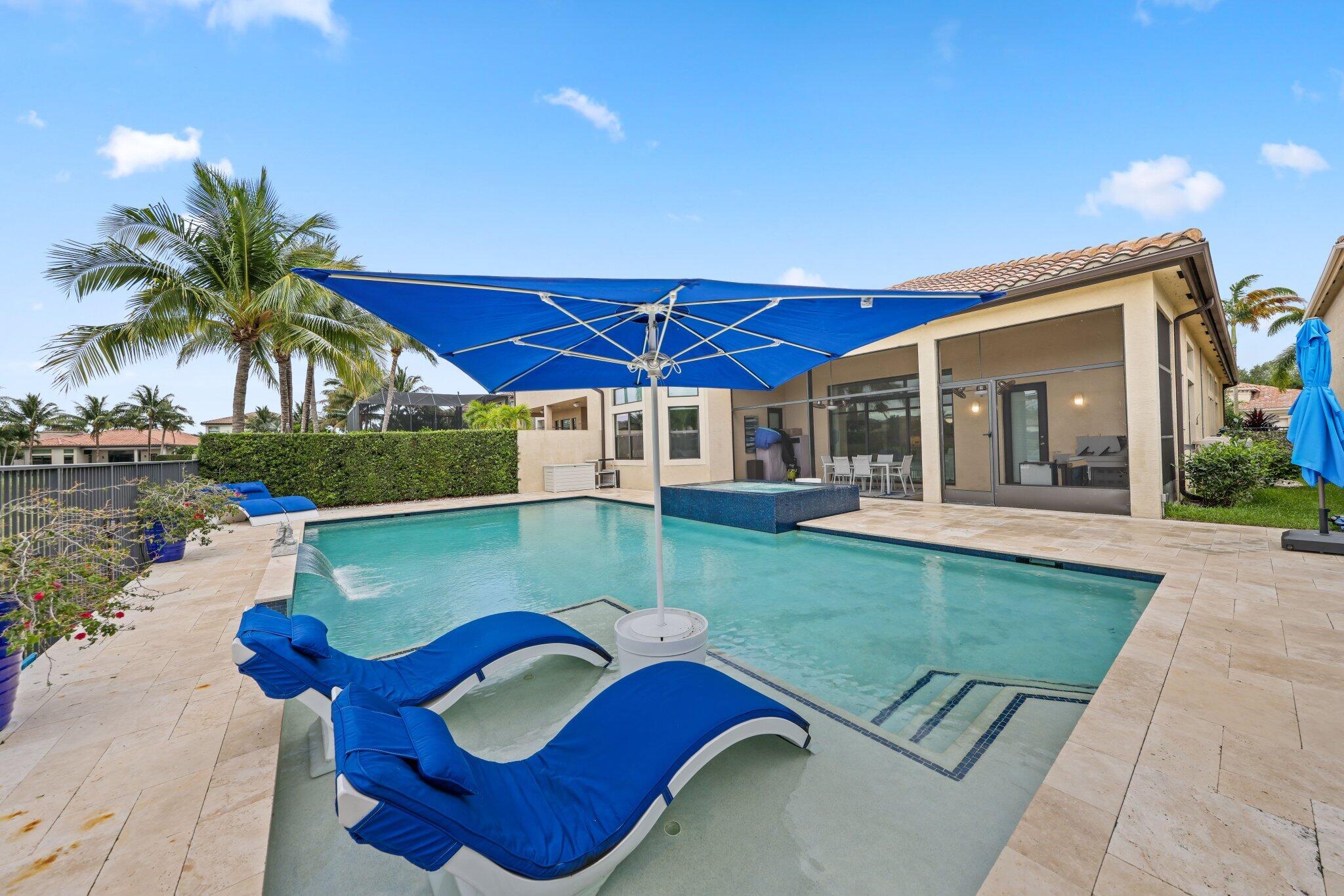 8539 Lewis River Road Delray Beach, FL 33446 - Photo 39 of 49 a view of a house with backyard and swimming pool