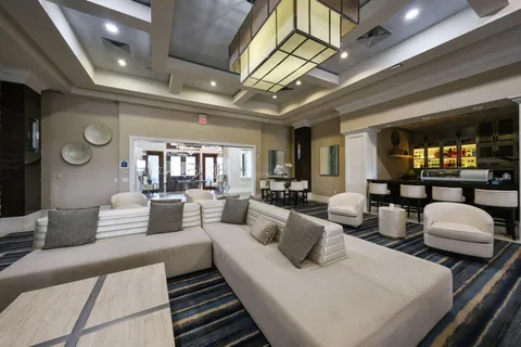 a view of swimming pool with sitting area