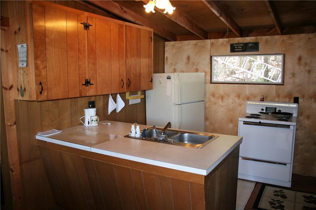 27 Beaver Dam Road Harrison, ME 04040 - Photo 11 of 27 Kitchen with electric stove and...