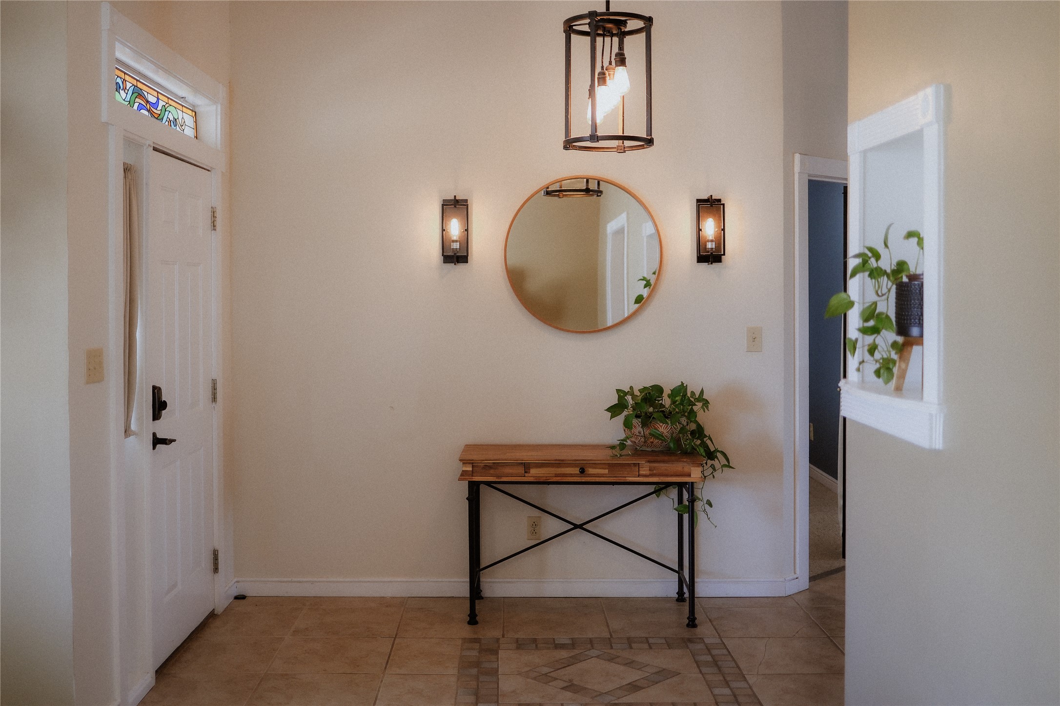 17323 Manda Carlson Road Manor, TX 78653 - Photo 6 of 29 An inviting entryway features detailed tile flooring, high ceilings, and a built-in wall niche.
