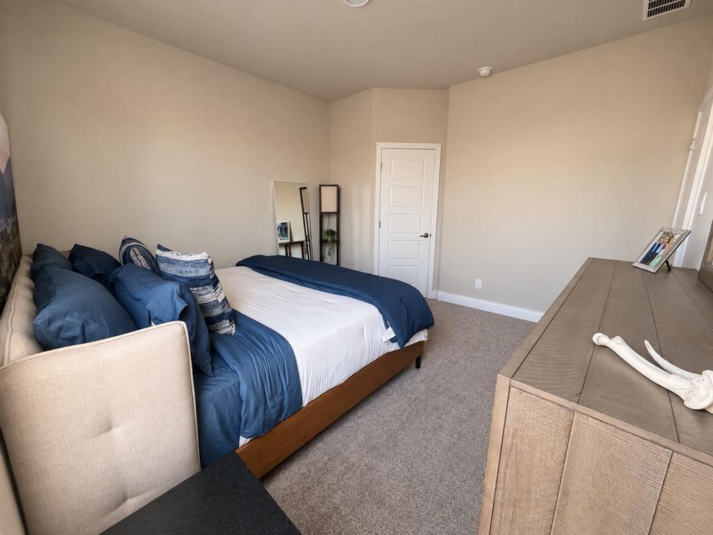 1605 Buzzard Road Denton, TX 76205 - Photo 17 of 27 Carpeted flooring with painted baseboards