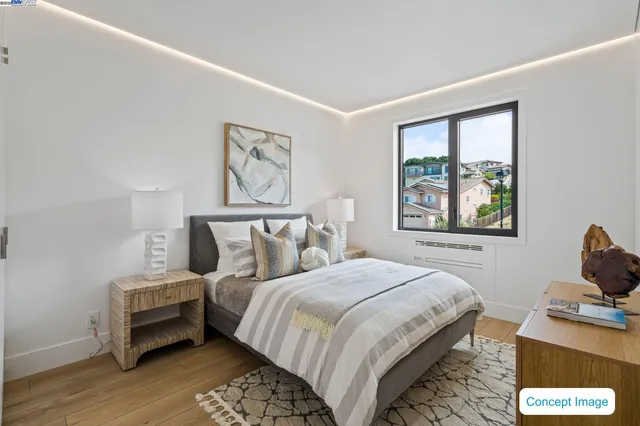 a bedroom with bed and a window