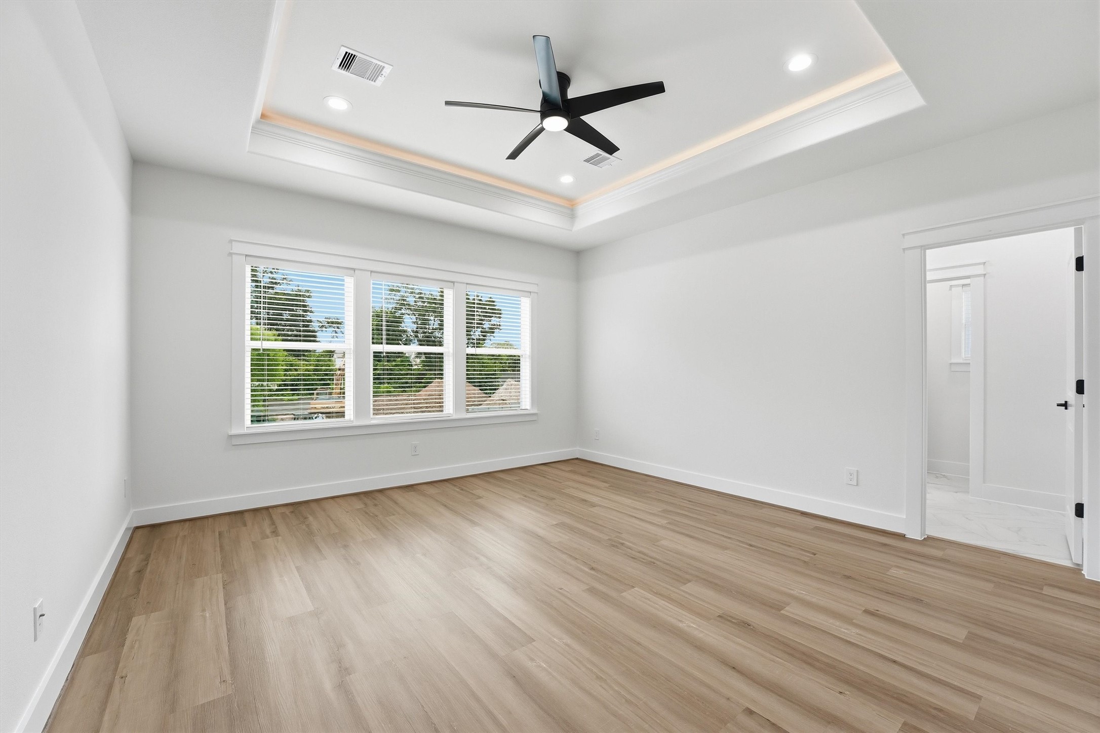 6128 Endeavor Heights Road Houston, TX 77091 - Photo 17 of 38 Elegant Tray Ceiling with Built-In LED Accent Lighting