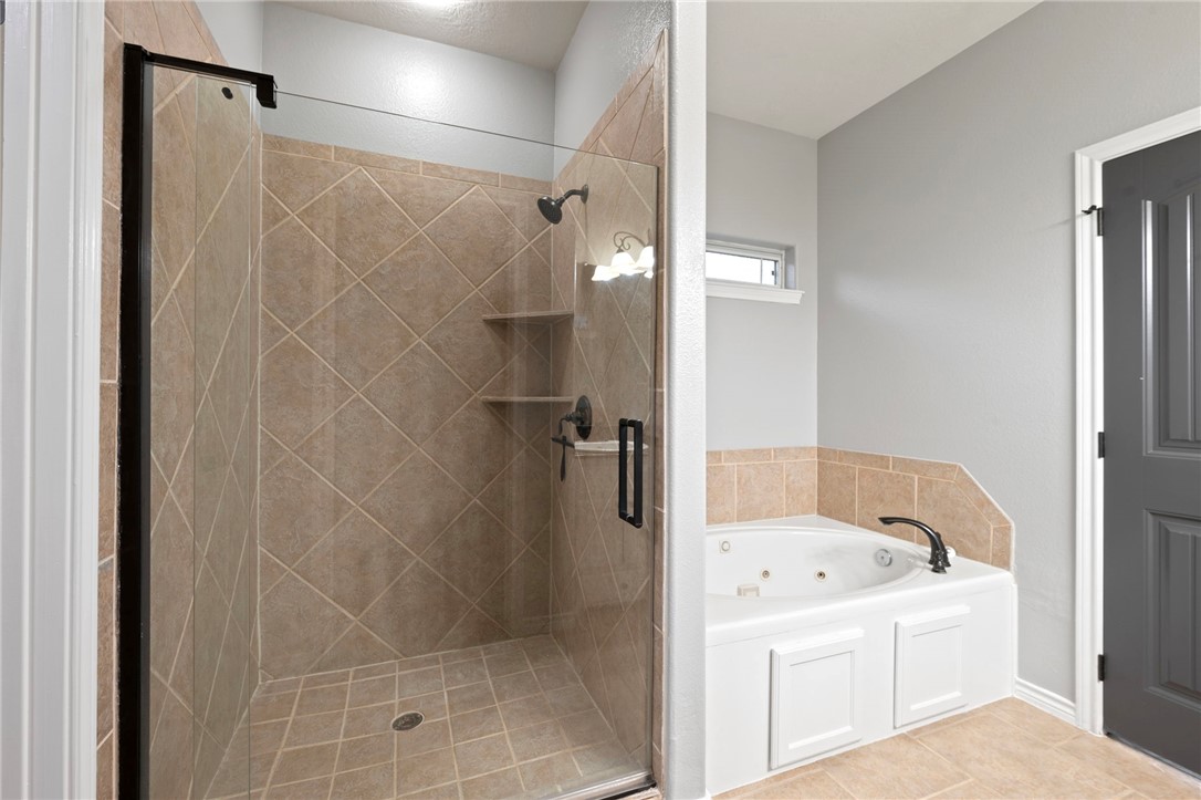 3304 Keefer Loop College Station, TX 77845 - Photo 12 of 21 a bathroom with a bathtub and shower