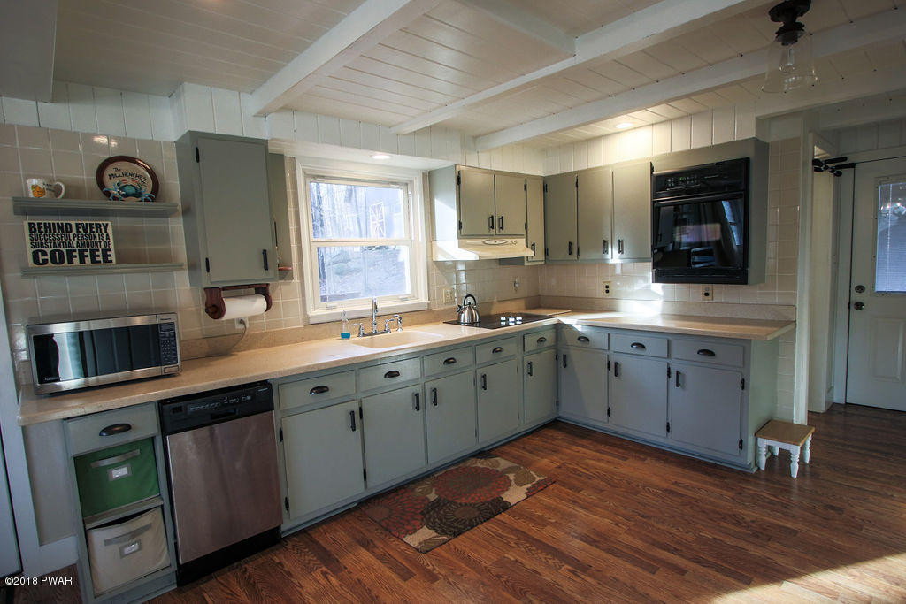 139 Raccoon Court Bushkill, PA 18324 - Photo 4 of 17 a large kitchen with stainless steel appliances granite countertop a sink and cabinets