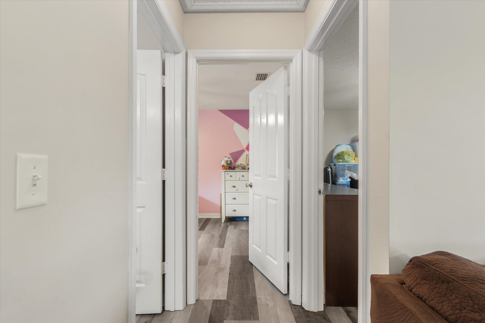 3372 4th Street Elkton, FL 32033 - Photo 14 of 36 Corridor featuring dark wood-style floors