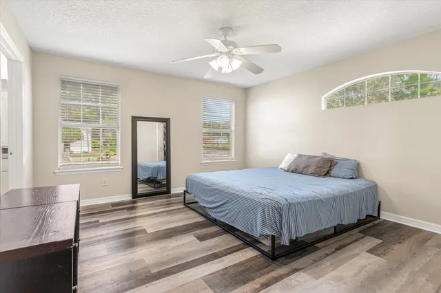 a bedroom with a bed and window