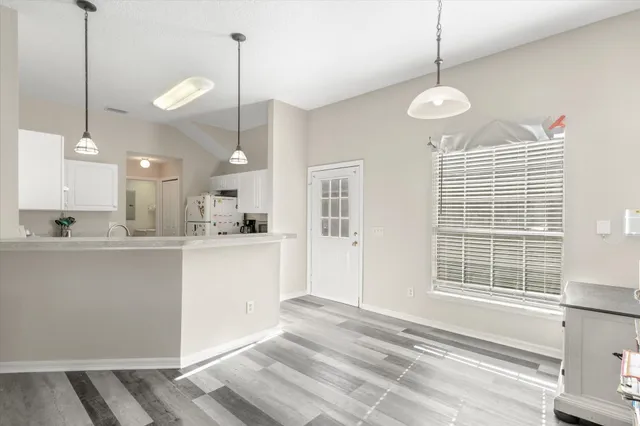 a view of a kitchen with windows