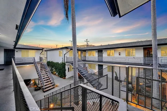 a view of balcony with wooden floor and outdoor seating