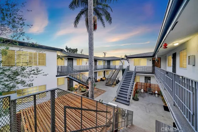 a view of balcony with wooden floor and outdoor seating