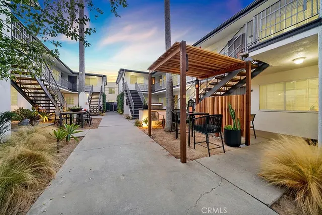 a view of a chairs and table in the patio