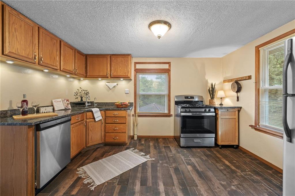2381 Highway 18 Clinton, PA 15026 - Photo 11 of 27 a kitchen with a sink stove and refrigerator
