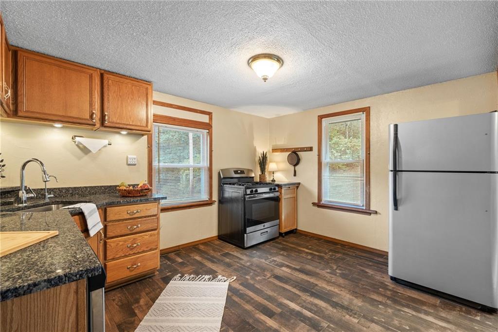 2381 Highway 18 Clinton, PA 15026 - Photo 12 of 27 a kitchen with stainless steel appliances granite countertop a refrigerator stove and sink