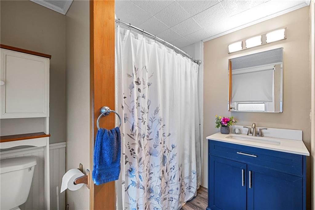 2381 Highway 18 Clinton, PA 15026 - Photo 17 of 27 a bathroom with a sink toilet and shower