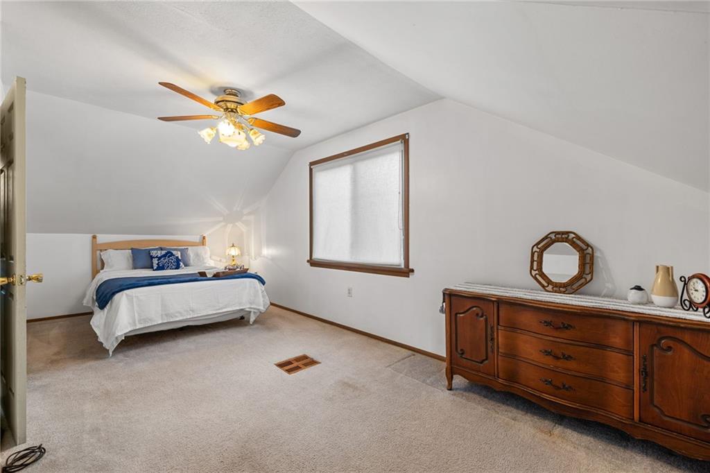 2381 Highway 18 Clinton, PA 15026 - Photo 20 of 27 a bedroom with a bed and a chandelier
