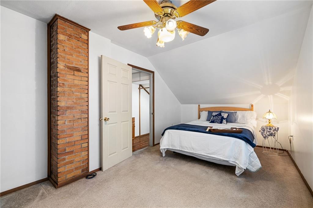 2381 Highway 18 Clinton, PA 15026 - Photo 21 of 27 a spacious bedroom with a bed and a chandelier