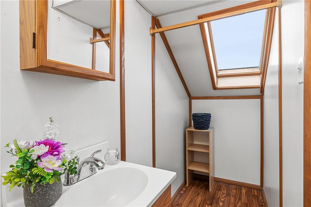 2381 Highway 18 Clinton, PA 15026 - Photo 23 of 27 a bathroom with a sink and a mirror