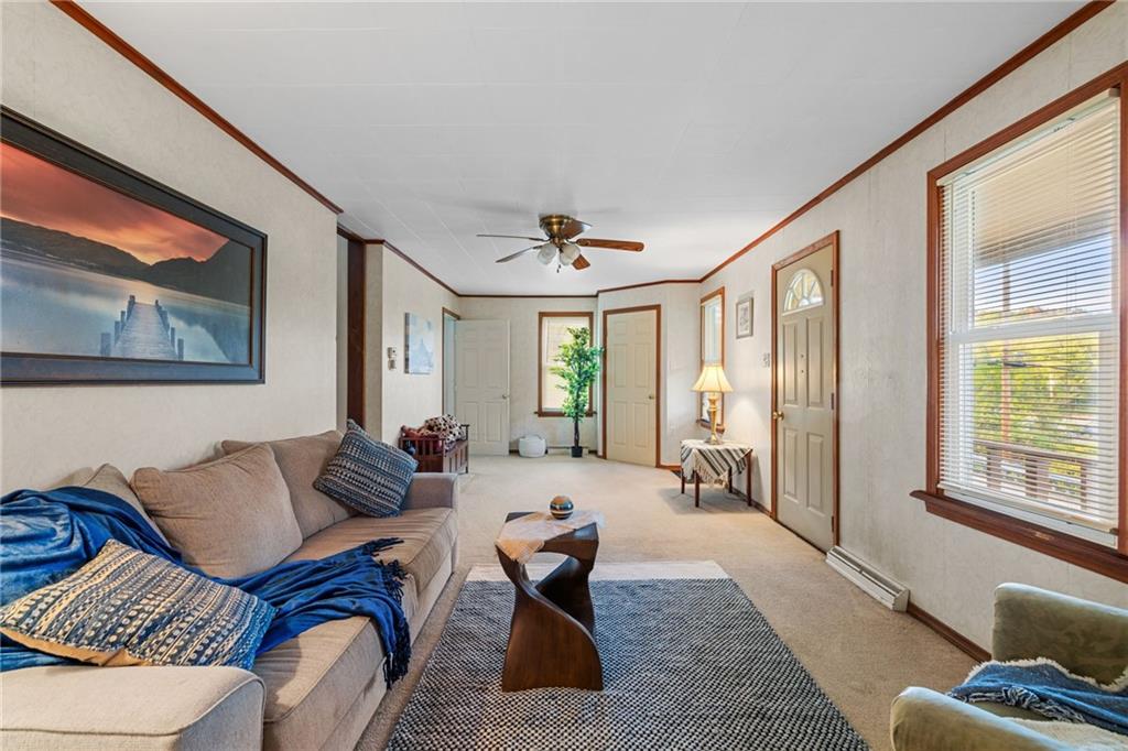 2381 Highway 18 Clinton, PA 15026 - Photo 5 of 27 a living room with furniture and floor to ceiling windows
