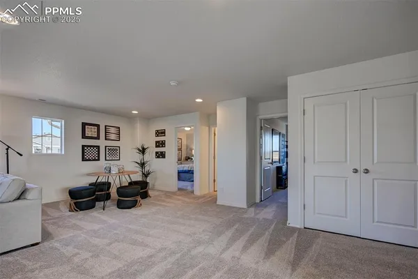 a view of a livingroom with furniture and window