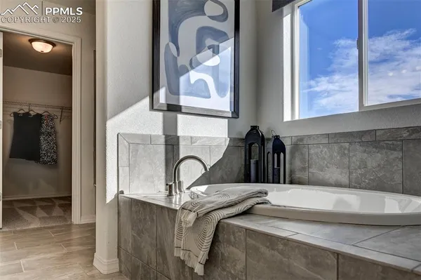 a close view of a faucet a sink and a mirror