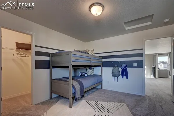 a bedroom with a bed and a walk in closet