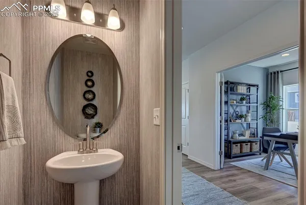 a bathroom with a sink and mirror