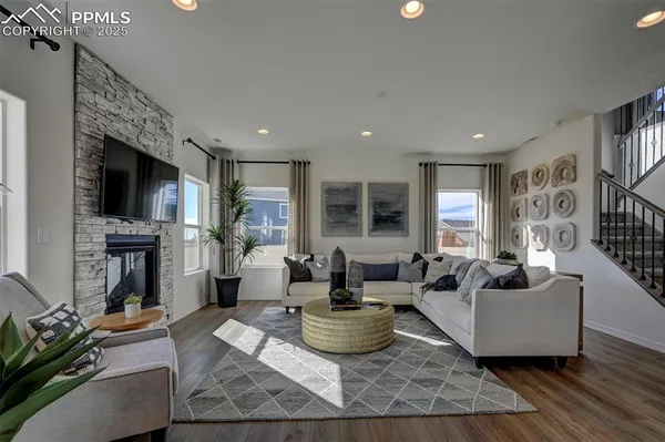 a living room with furniture and a flat screen tv