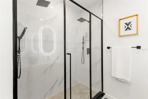 a bedroom with a bed and a potted plant