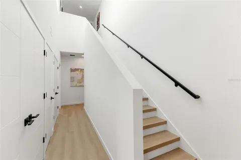 a view of a workspace room with furniture and wooden floor