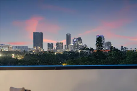 a view of a swimming pool with furniture