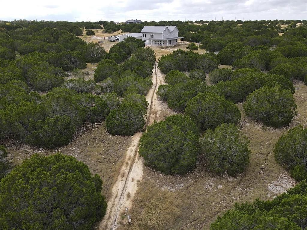 1901 Greystone Ranch Road Bertram, TX 78605 - Photo 18 of 34 a view of a lot of trees and mountains