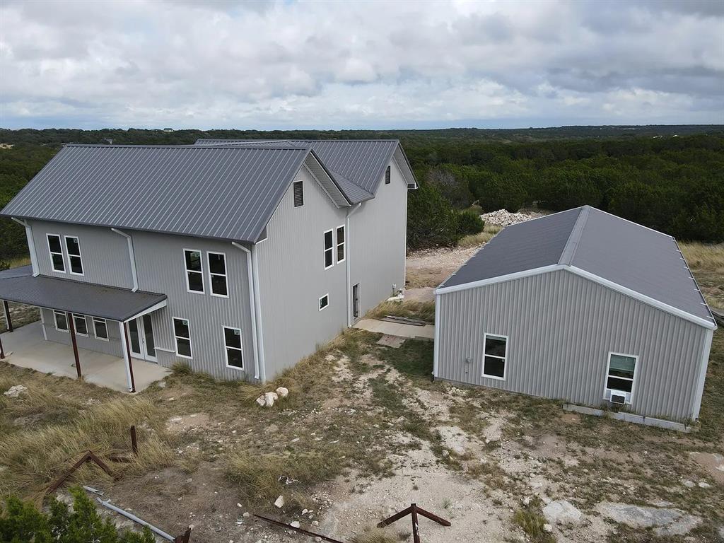 1901 Greystone Ranch Road Bertram, TX 78605 - Photo 22 of 34 a aerial view of a house with a yard