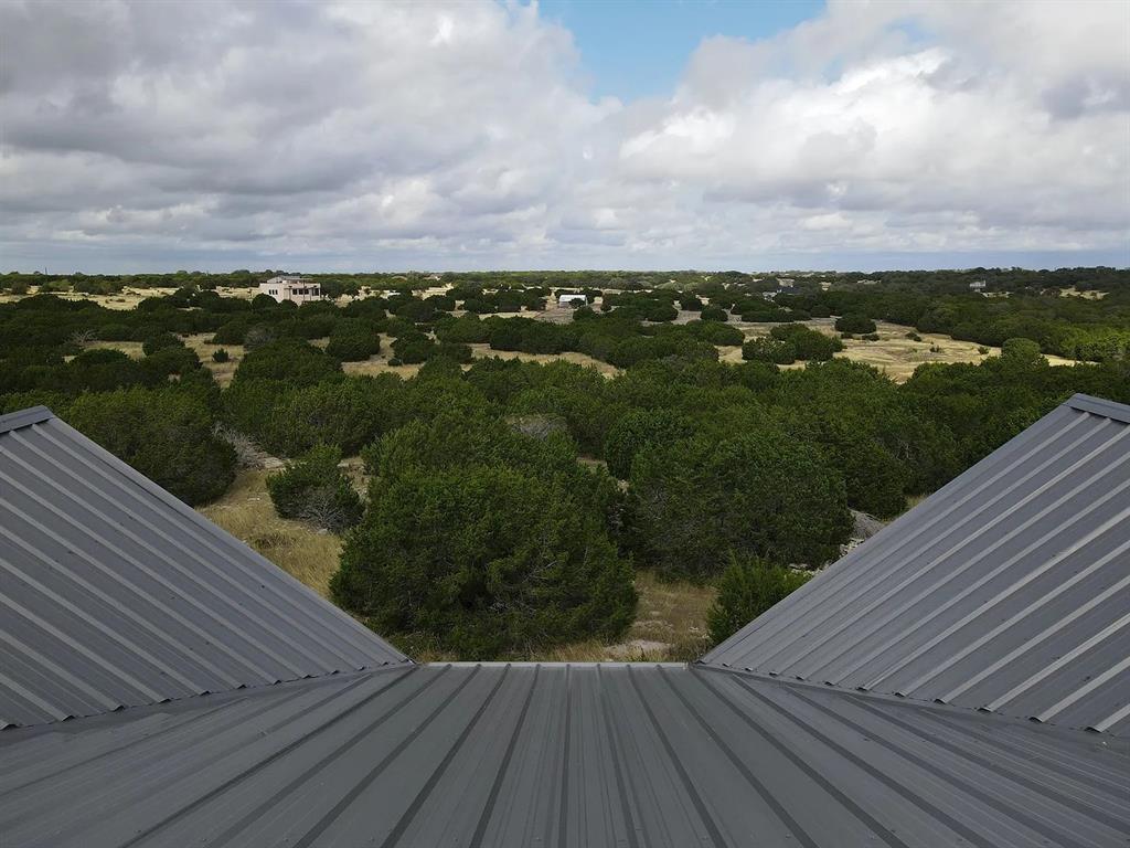 1901 Greystone Ranch Road Bertram, TX 78605 - Photo 25 of 34 a view of a balcony with an ocean view