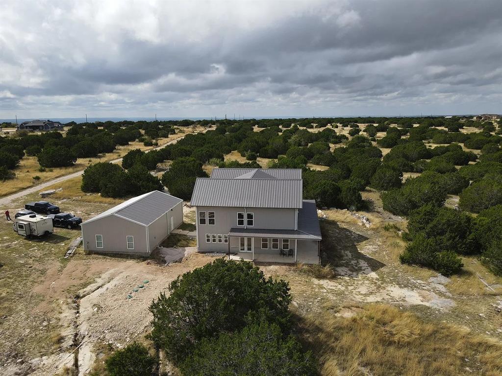 1901 Greystone Ranch Road Bertram, TX 78605 - Photo 26 of 34 an aerial view of a house with a garden