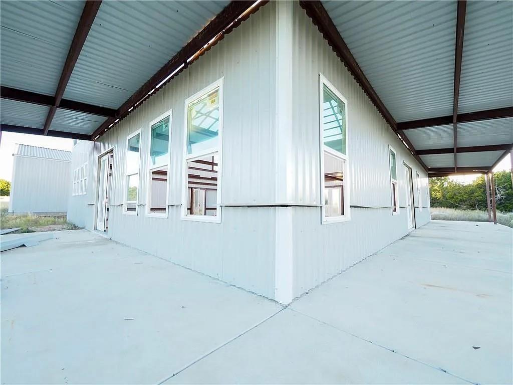 1901 Greystone Ranch Road Bertram, TX 78605 - Photo 30 of 34 a view of a house with porch