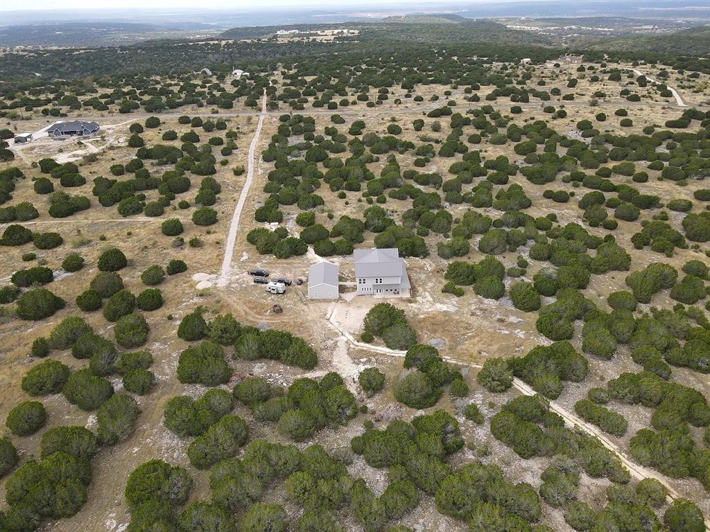1901 Greystone Ranch Road Bertram, TX 78605 - Photo 8 of 34 an aerial view of residential houses with city view