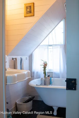 a room with furniture and a potted plant