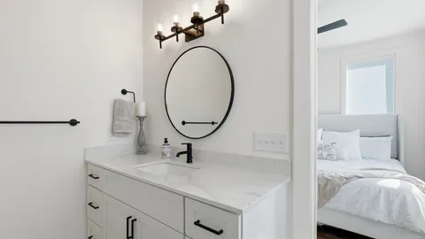 a bathroom with a sink and mirror
