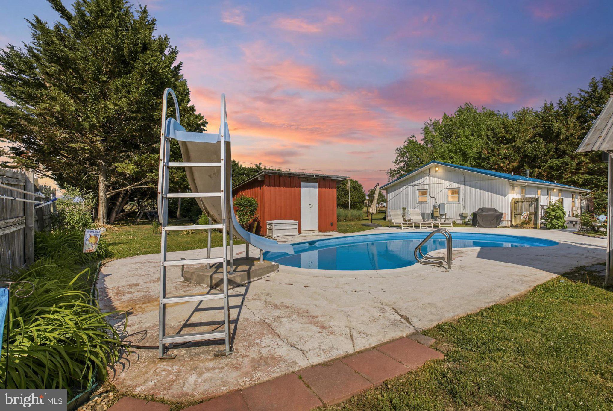 310 Dogtown Road Townsend, DE 19734 - Photo 29 of 43 Sunset Splash: Fun by the Poolside