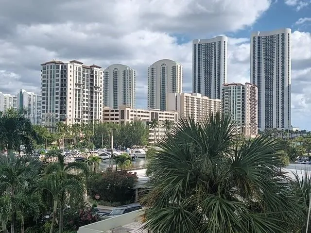 a view of a city with tall buildings