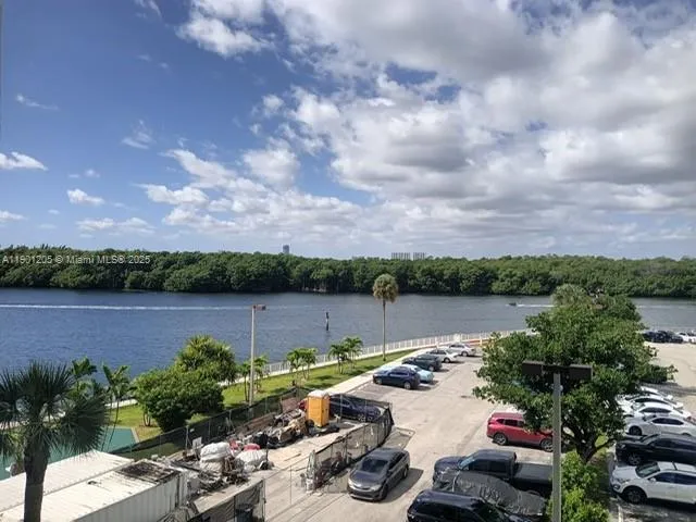 a view of a lake with furniture