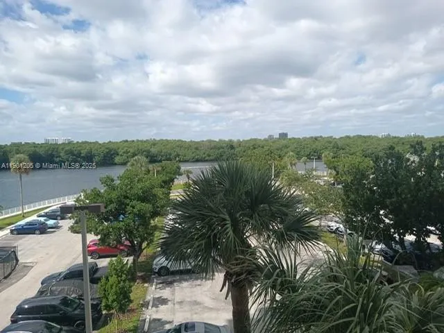a view of a lake with top of house